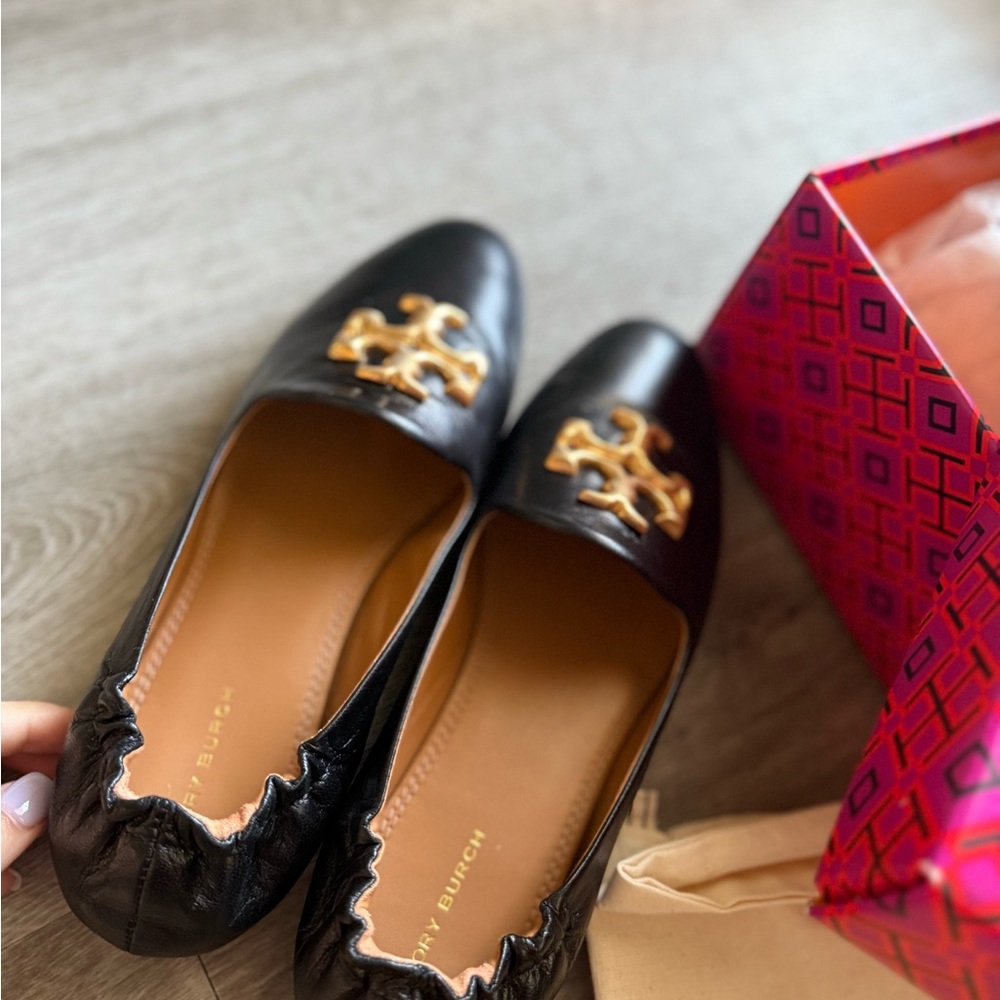 Tory Burch Black and Gold Flats with Signature Emblem